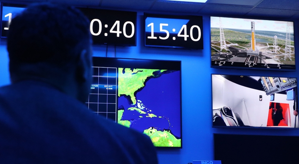 A subject looks at NASA monitors at the Cosmosphere