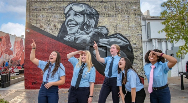 K-State Salina female pilot students stand outside of the downtown Salina mural tour.