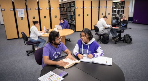 Students studying in a multi-use space at the K-State Salina library.