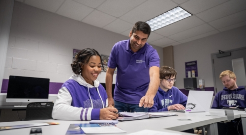 A student being instructed by one of K-State Salina's faculty experts while in class. 