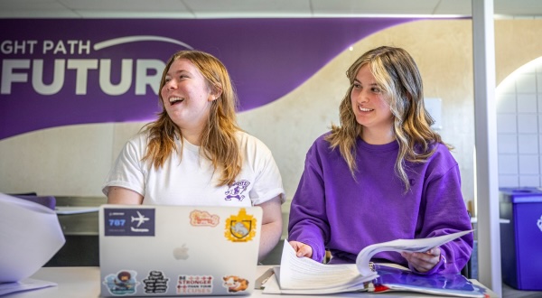 Two K-State Salina students enjoying time studying in the General Atomics Lounge.