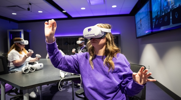 A student studies with a virtual reality headset in K-State Salina's state-of-the-art on-campus XR lab.