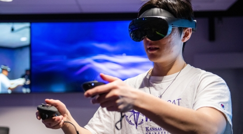 A student uses a virtual reality headset at the K-State Salina state-of-the-art on-campus XR lab. 