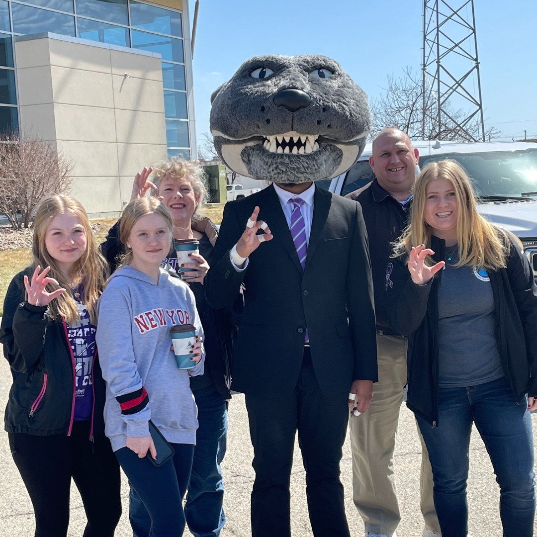 A family stands with Willie Wildcat at Open House at K-State Salina. Click here for more information on the 2025 open house.