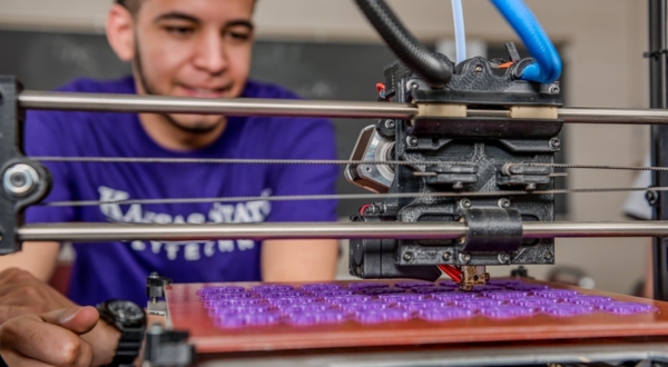 A K-State Salina student engineers a product on a 3D printer.