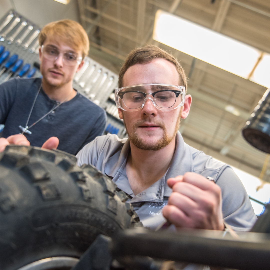 Students working on vehicle