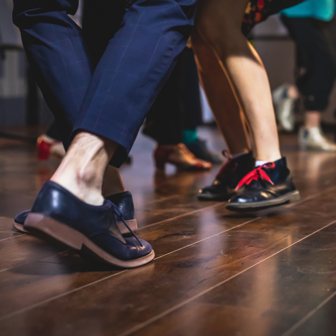 Feet dancing on wood floor